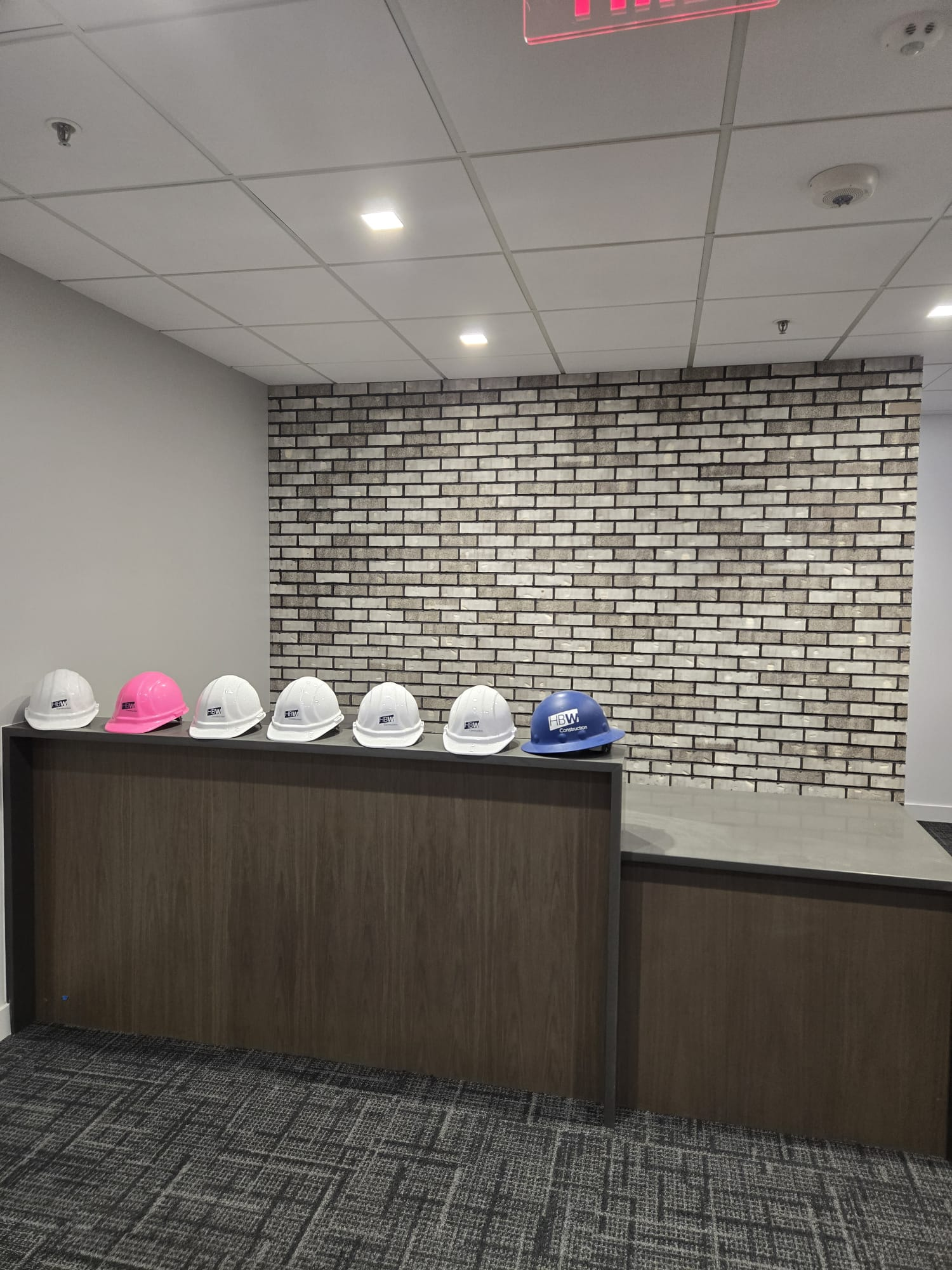 Tile wall installation with construction helmets