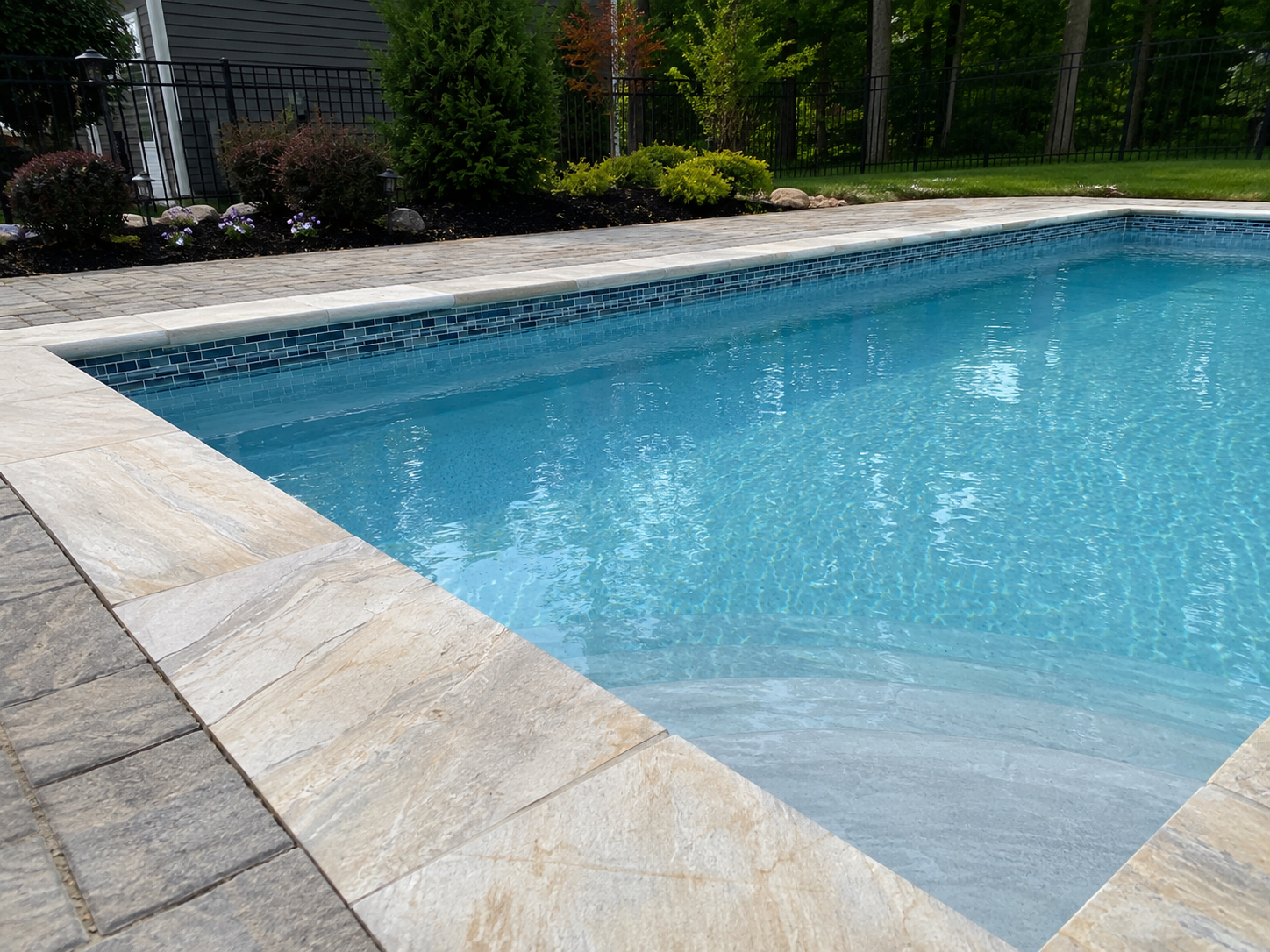 Illustrative pool tile and stone application